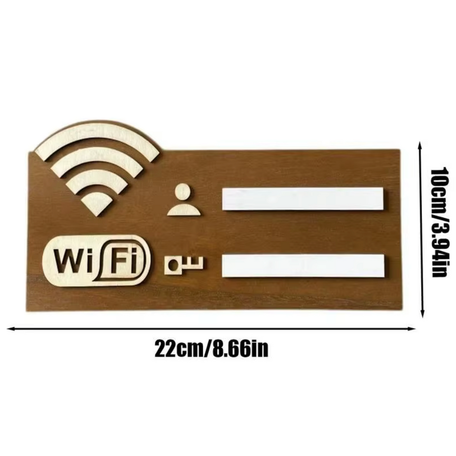 Cartel madera WiFi reutilizable con rotulador sobre mesa de alojamiento rural